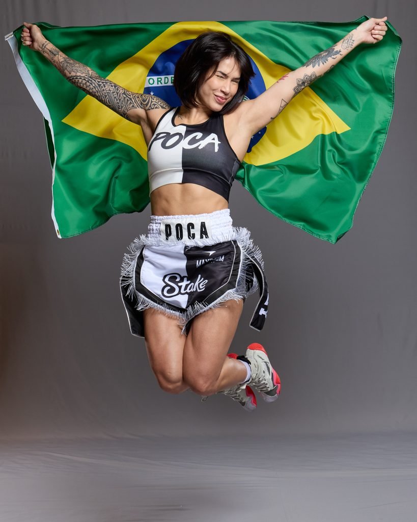 Jully Poca with a Brazil flag and branded fight kit to launch her Stake partnership